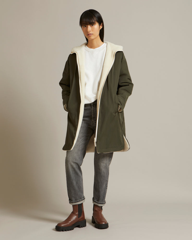 Reversible parka in water repellent technical fabric and shearling