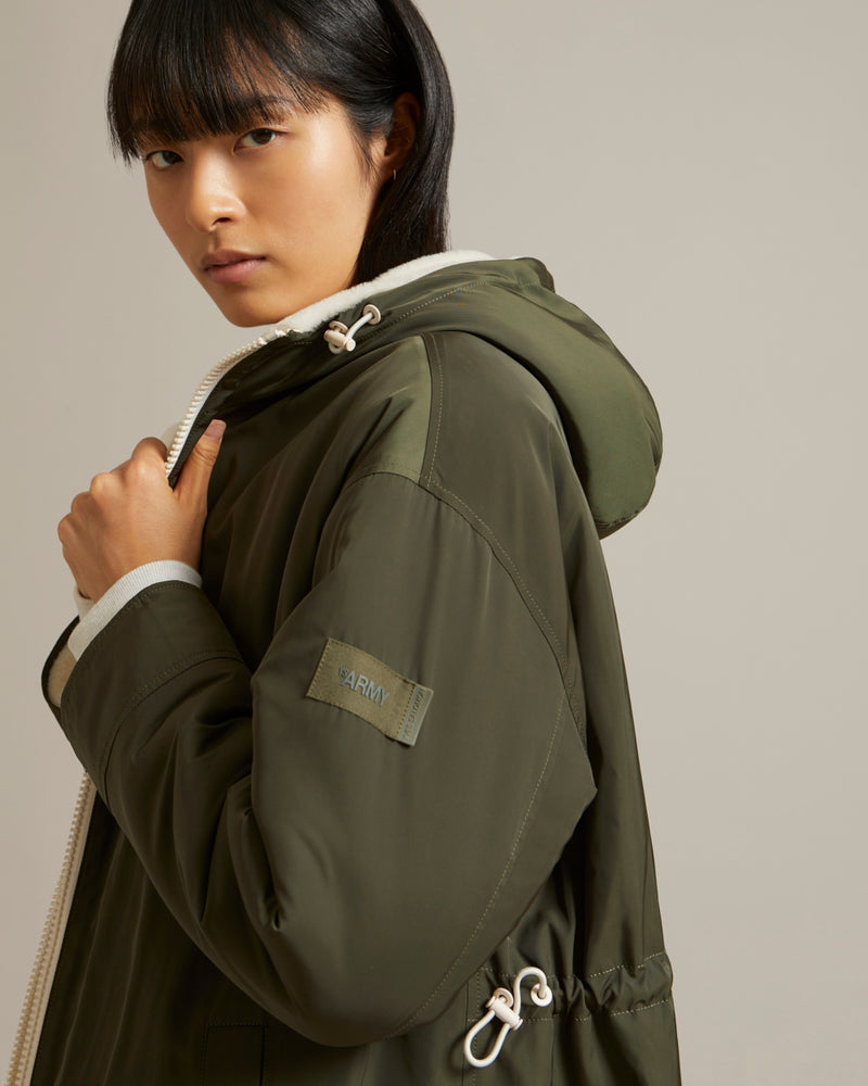 Reversible parka in water-repellent technical fabric and shearling