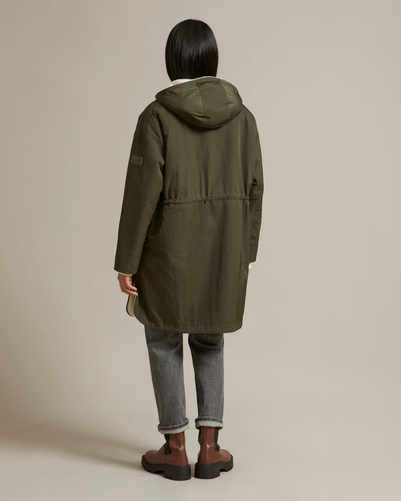 Reversible parka in water-repellent technical fabric and shearling