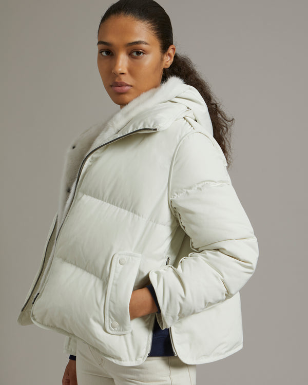 "A" line down jacket in technical fabric with long-haired mink hooded bib