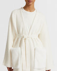 Long knit cardigan with mink fur over-pockets