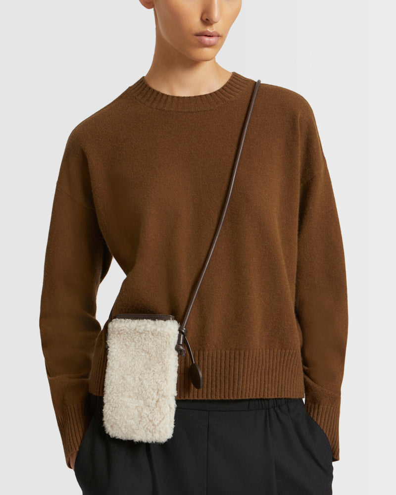 Phone case in curly merino and leather
