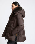 A-line down jacket in waterproof technical fabric with airy lambswool trim
