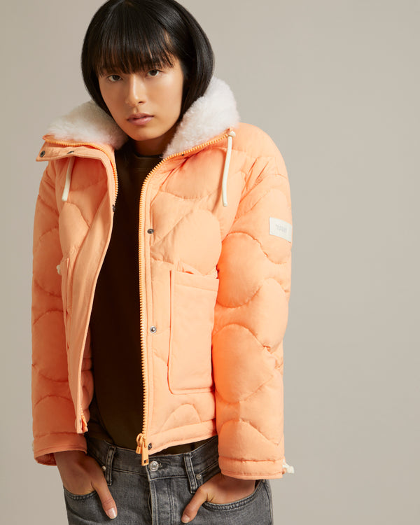 Down jacket in water-repellent technical fabric with short-haired lambskin collar trim