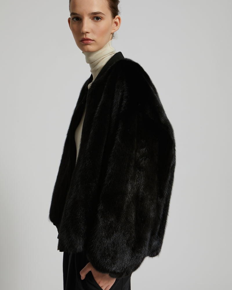 Reversible bomber jacket in water-repellent technical fabric and long-haired mink