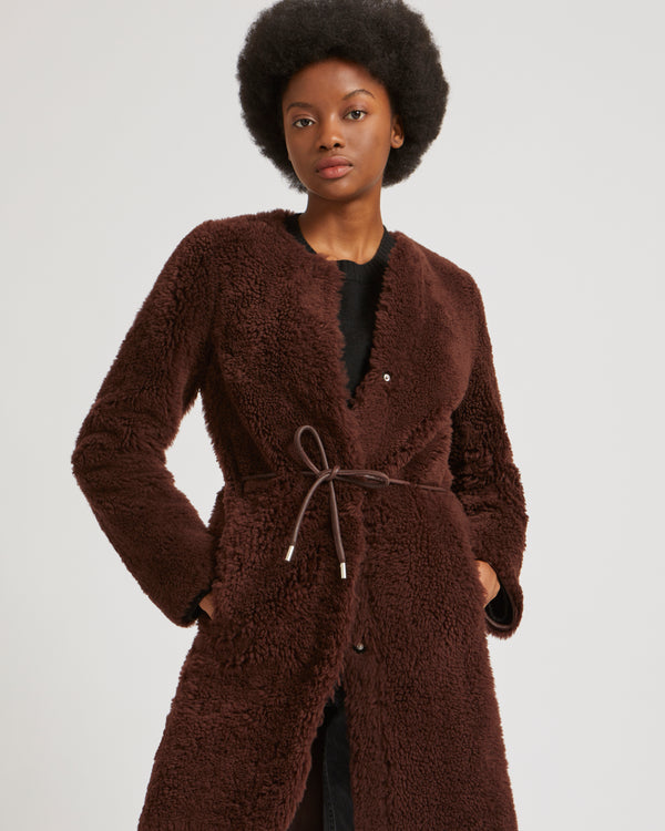 Collarless belted coat in long-haired merinillo