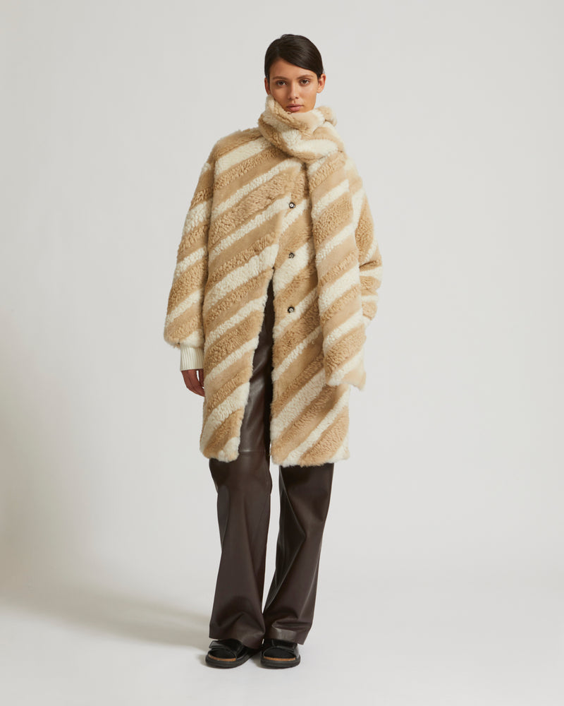 Long coat in curly merino wool and shearling