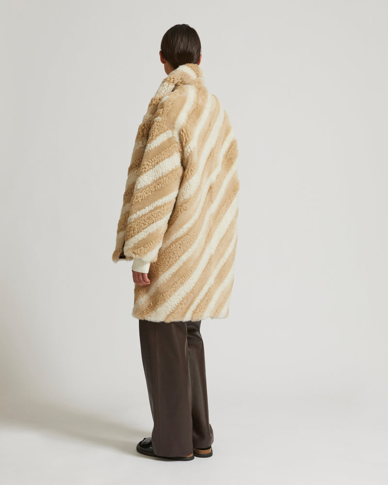 Long coat in curly merino wool and shearling