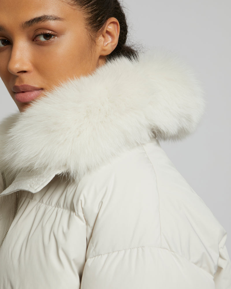 Boxy down jacket in waterproof technical fabric with fox fur collar