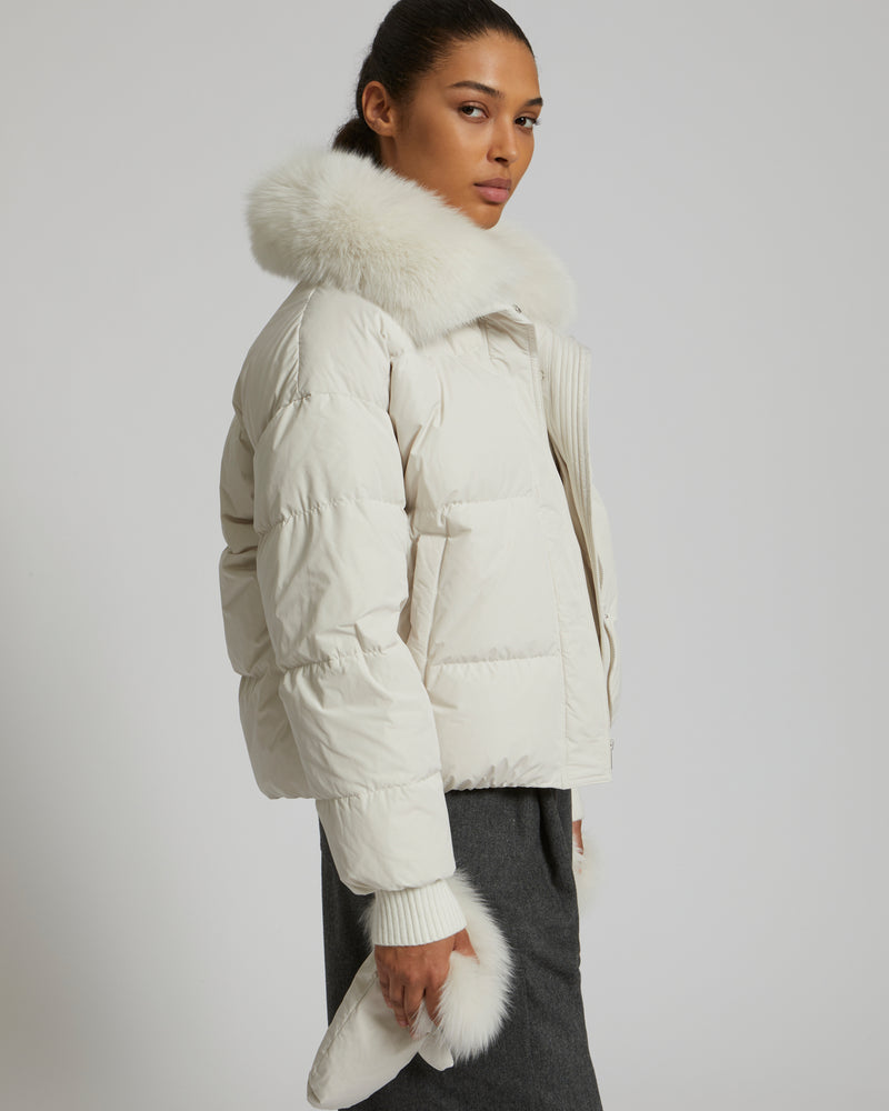 Boxy down jacket in waterproof technical fabric with fox fur collar