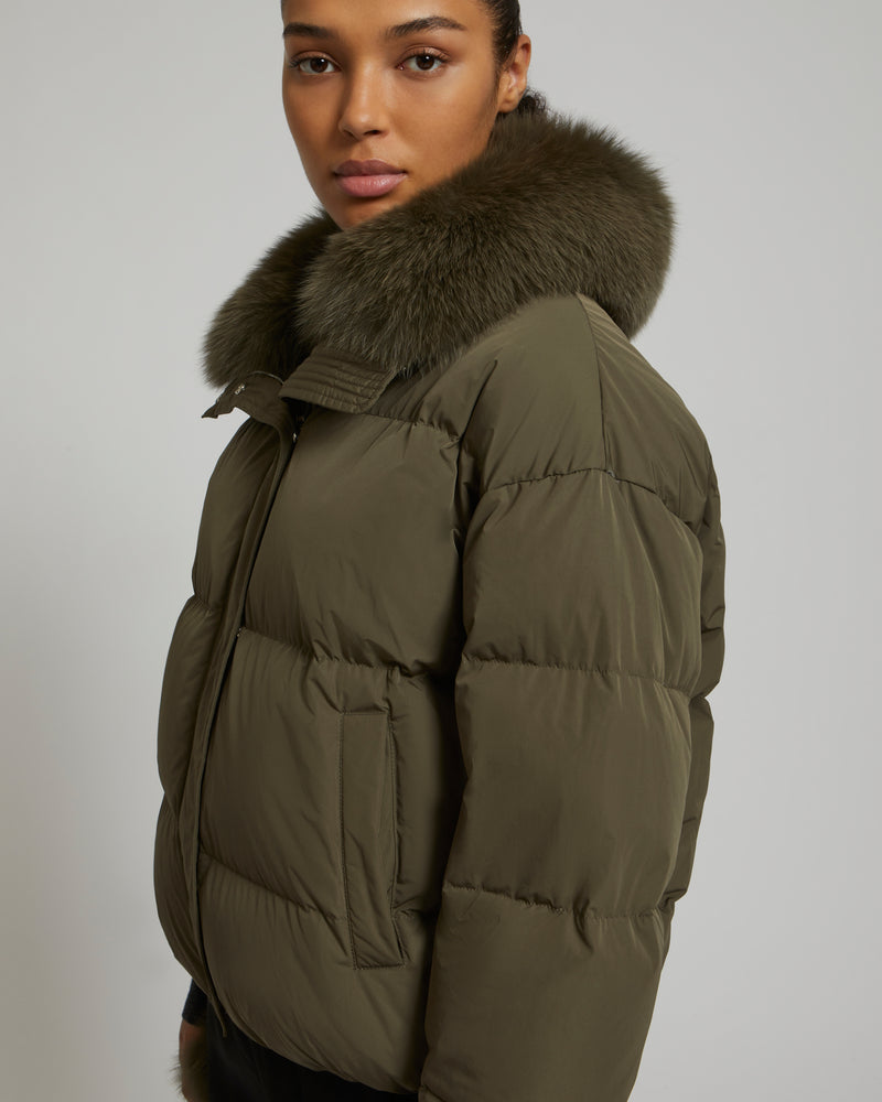 Boxy down jacket in waterproof technical fabric with fox fur collar