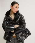 Hooded down jacket in shiny laminated nylon after ski
