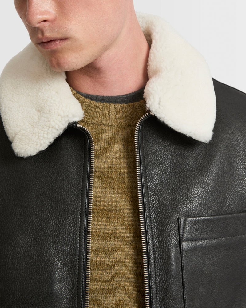 Leather jacket with shearling collar