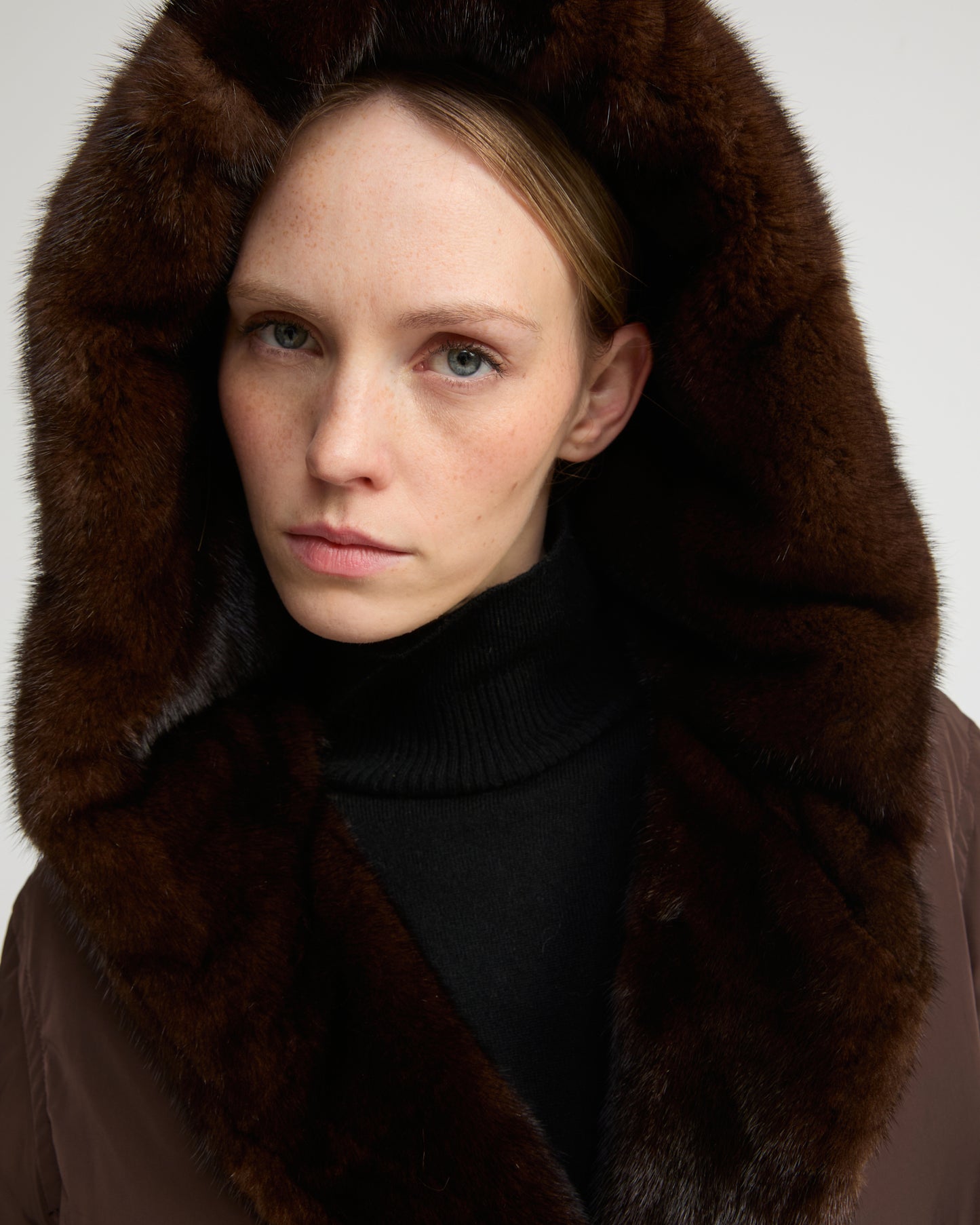 Long down jacket in technical fabric and mink fur
