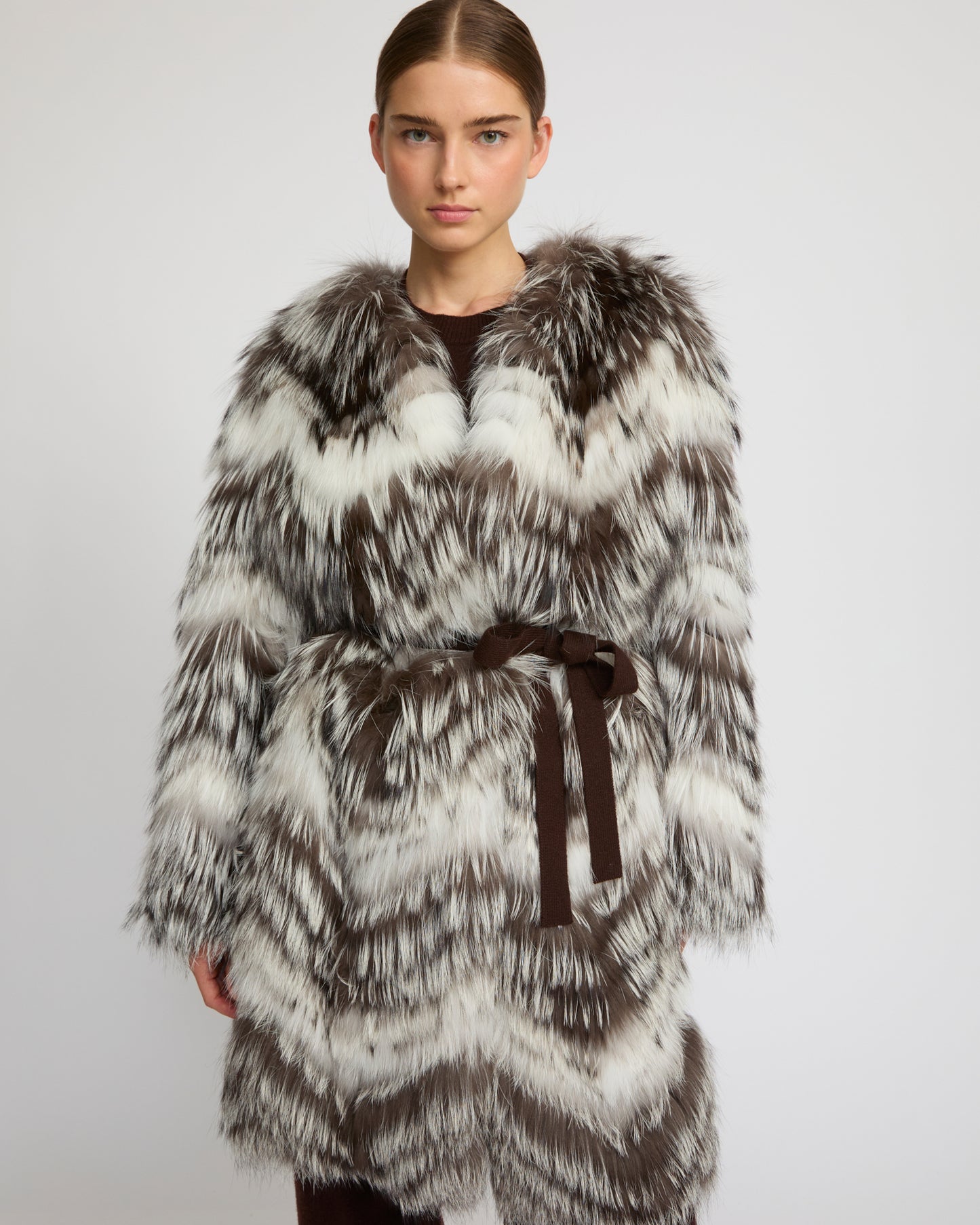 Belted coat in merino knit and fox fur