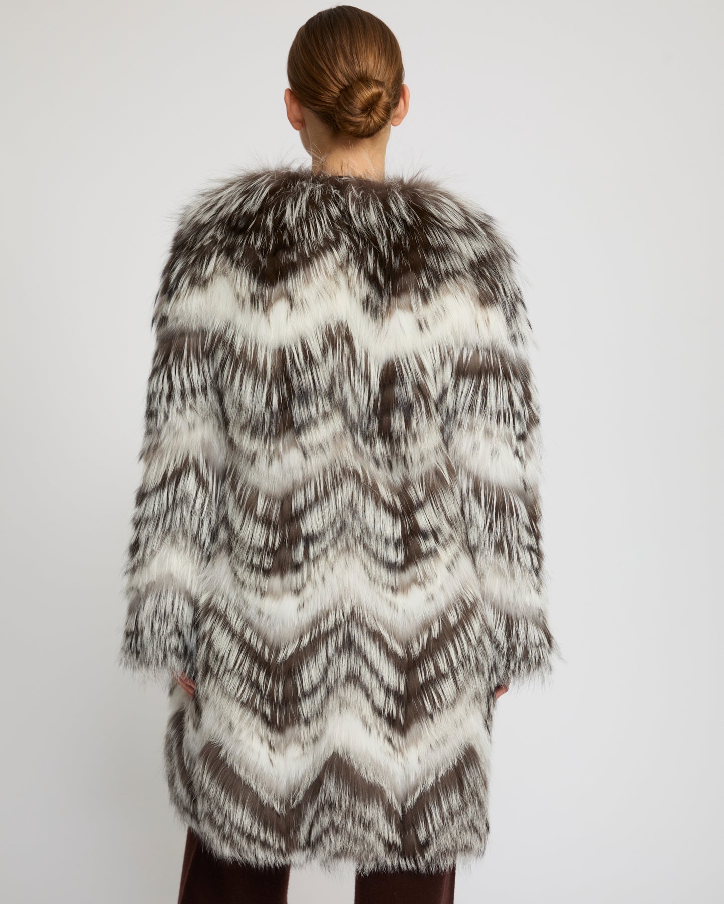 Belted coat in merino knit and fox fur
