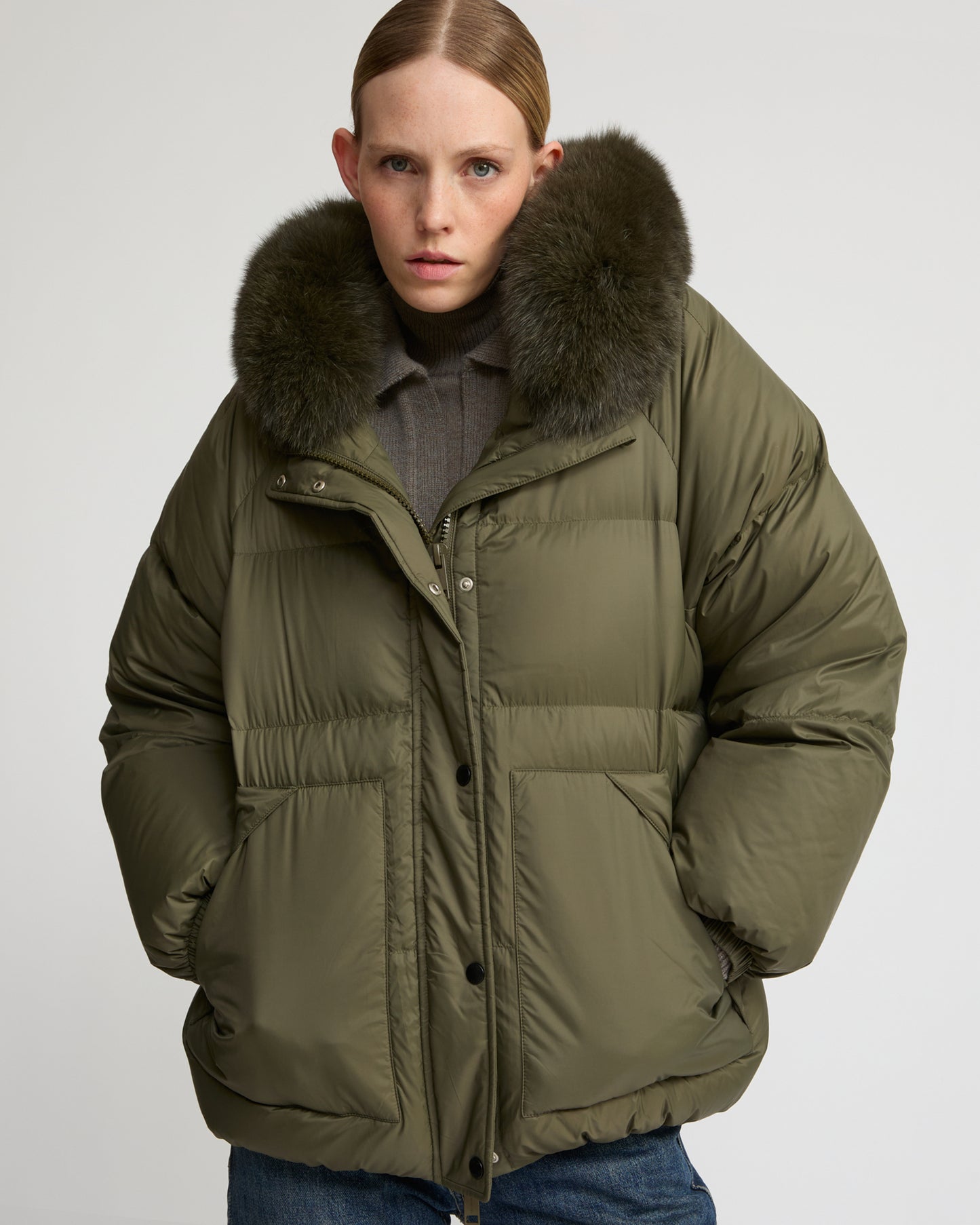 Short down jacket with raglan sleeves and fox fur trim