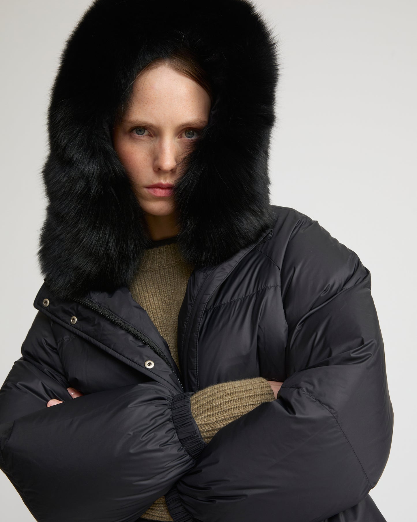 Short down jacket with raglan sleeves and fox fur trim