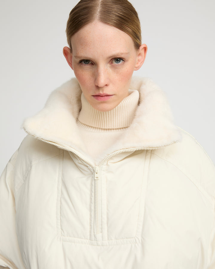 Technical fabric down cape with mink fur stand collar and lining. -Yves Salomon
