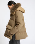 Hooded down jacket in Loro Piana 100% cashmere membrane fabric with long curly lambskin trim