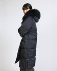 Long down jacket in waterproof technical fabric with airy lamb wool trim
