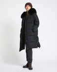 Long down jacket in waterproof technical fabric with fox fur trim