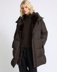Long down jacket in water-repellent technical fabric with mink fur bib panel