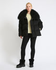 Down jacket in Loro Piana cashmere fabric with long curly lambskin collar