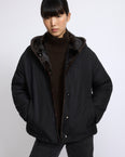 Short smooth hooded down jacket in water-repellent technical fabric with mink fur lining