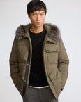 Short down jacket in technical fabric with fox fur trim