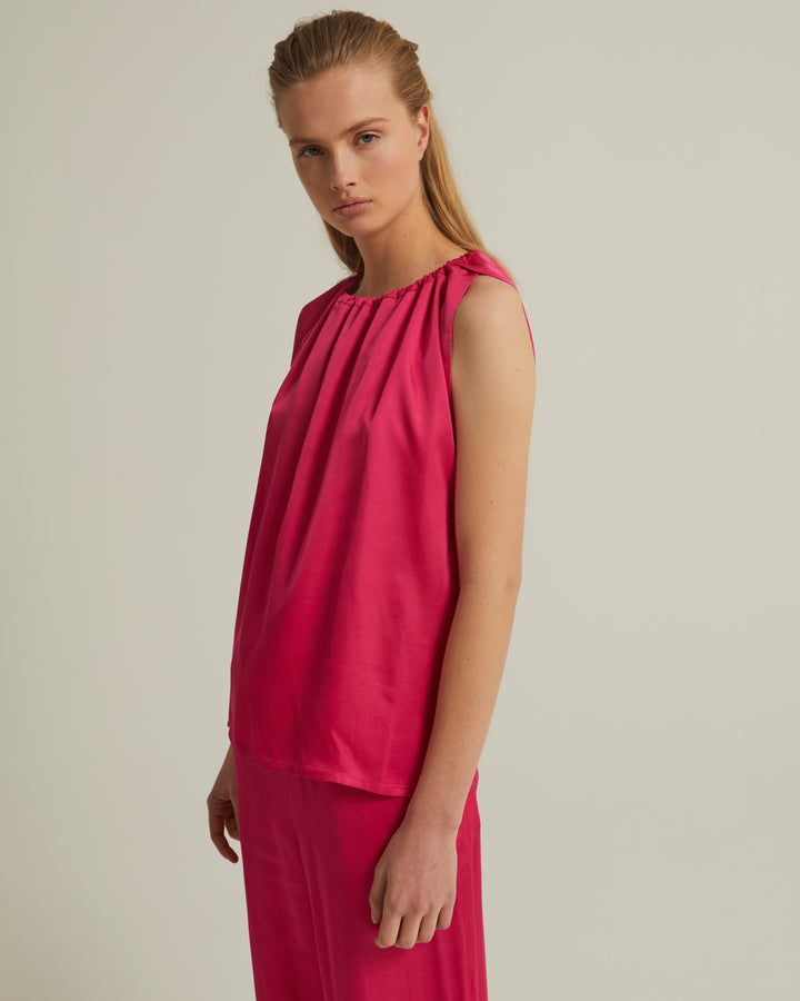 Sleeveless top with adjustable satin neckline